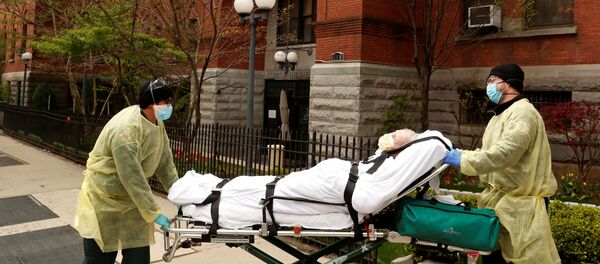 Emergency Medical Technicians (EMTs) wheel a man out of the Cobble Hill Health Center nursing home during an ongoing outbreak of the coronavirus disease (COVID-19) in the Brooklyn borough of New York, U.S., April 17, 2020 - Sputnik International