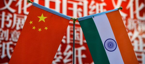 The national flags of India (R) and China are seen at the Delhi World Book fair at Pragati Maidan in New Delhi on January 9, 2016.  - Sputnik International