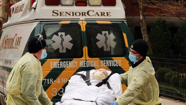 Emergency Medical Technicians (EMTs) wheel a man out of the Cobble Hill Health Center nursing home during an ongoing outbreak of the coronavirus disease (COVID-19) in the Brooklyn borough of New York, U.S., April 17, 2020 - Sputnik International
