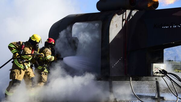 Firefighters from the 355th Civil Engineer Squadron extinguish a fire during training at Davis-Monthan Air Force Base, Ariz., April 14, 2020.  - Sputnik International