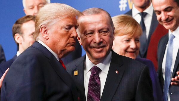 U.S. President Donald Trump and Turkey's President Recep Tayyip Erdogan leave the stage after family photo during the annual NATO heads of government summit at the Grove Hotel in Watford, Britain December 4, 2019 - Sputnik International