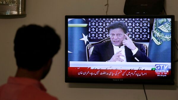 A television screen displays Prime Minister of Pakistan Imran Khan, announcing the extension of a country-wide lockdown for two weeks, due to the ongoing spread of the coronavirus disease (COVID-19), in Karachi, Pakistan April 14, 2020 - Sputnik International
