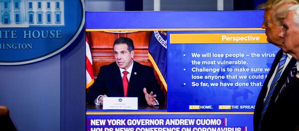 U.S. President Donald Trump and U.S. Vice President Mike Pence watch a video of New York governor Andrew Cuomo speaking at Cuomo's daily briefing, during the daily coronavirus disease (COVID-19) task force briefing at the White House in Washington, U.S., April 19, 2020. - Sputnik International