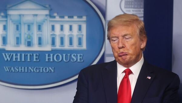 U.S. President Donald Trump reacts to a comment from Vice President Mike Pence as he talks with the vice president during the daily coronavirus task force briefing at the White House in Washington, U.S., April 22, 2020.  - Sputnik International