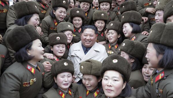 In this undated photo provided Nov. 25, 2019, by the North Korean government, North Korean leader Kim Jong Un, center, poses as he inspects a women's company under Unit 5492 of the Korean People's Army in North Korea - Sputnik International