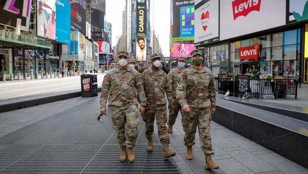 New York State Army National Guard soldiers walk through Times Square, during the outbreak of the coronavirus disease (COVID-19) in New York City, New York, U.S., April 20, 2020 - Sputnik International