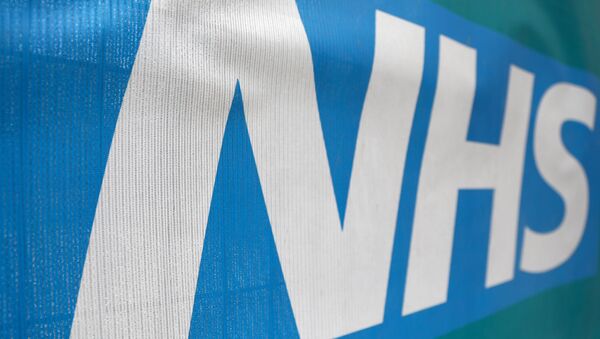 An NHS logo is displayed outside a hospital in London, Britain May 14, 2017. - Sputnik International
