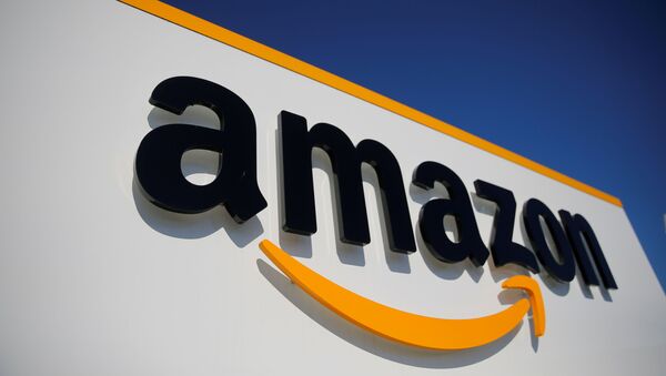 The logo of Amazon is seen at the company logistics center in Lauwin-Planque, northern France, April 22, 2020 after Amazon extended the closure of its French warehouses until April 25 included, following dispute with unions over health protection measures amid the coronavirus disease (COVID-19) outbreak - Sputnik International