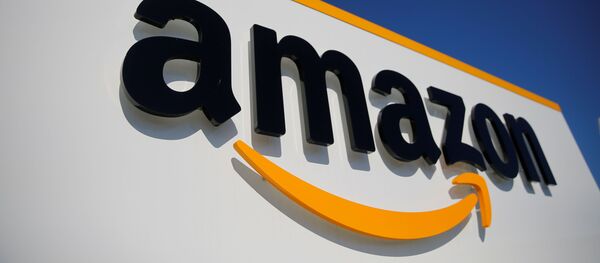 The logo of Amazon is seen at the company logistics center in Lauwin-Planque, northern France, April 22, 2020 after Amazon extended the closure of its French warehouses until April 25 included, following dispute with unions over health protection measures amid the coronavirus disease (COVID-19) outbreak - Sputnik International