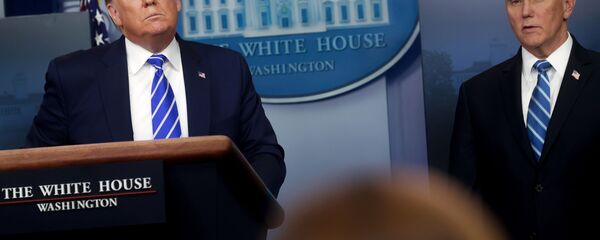 U.S. President Donald Trump listens to a question with Vice President Mike Pence during the daily coronavirus disease (COVID-19) outbreak task force briefing at the White House in Washington, U.S. April 23, 2020.   - Sputnik International
