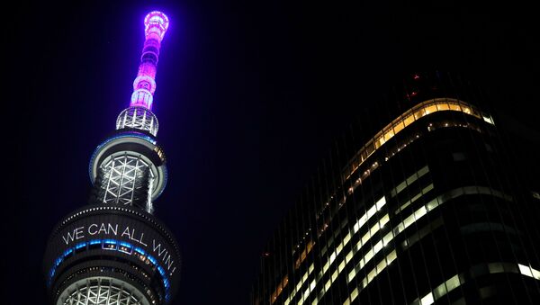 A message reading Together we can all win is displayed at the Tokyo Skytree after Japan's Prime Minister Shinzo Abe declared a state of emergency to fight the coronavirus disease (COVID-19), in Tokyo, Japan April 7, 2020 - Sputnik International