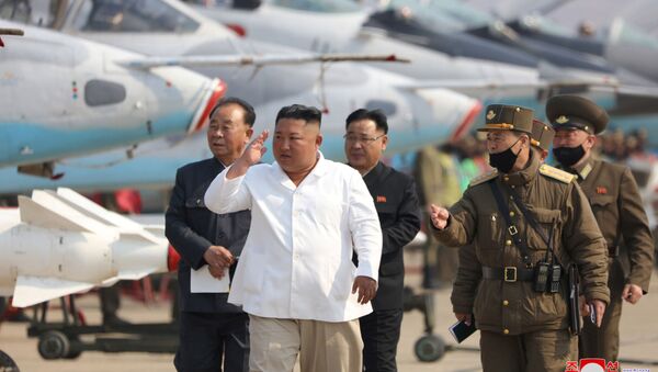 North Korean leader Kim Jong Un visits a pursuit assault plane group under the Air and Anti-Aircraft Division in the western area  in this undated image released by North Korea's Korean Central News Agency (KCNA) in Pyongyang on April 12, 2020 - Sputnik International