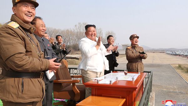North Korean leader Kim Jong Un applauds while visiting a pursuit assault plane group under the Air and Anti-Aircraft Division in the western area in this undated image released by North Korea's Korean Central News Agency (KCNA) in Pyongyang on April 12, 2020 - Sputnik International