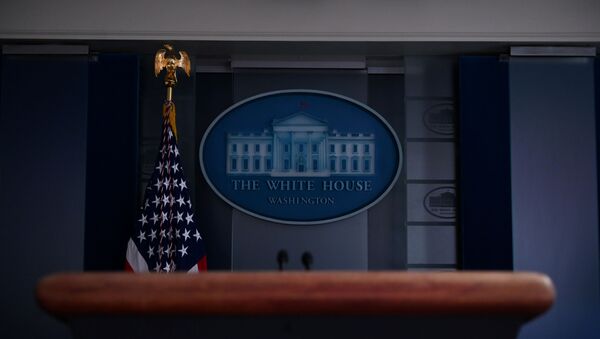 The White House briefing room podium is dark and empty after the coronavirus task force did not hold a briefing for the second day in a row in Washington, U.S., April 26, 2020 - Sputnik International
