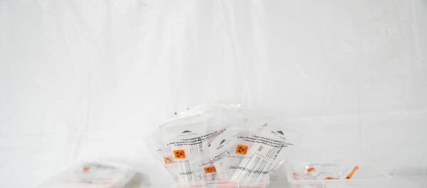 FILE PHOTO: Testing kits rest on a table at a One Medical testing facility built to help with the coronavirus disease (COVID-19) outbreak, in the Bronx borough of New York City, U.S., April 21, 2020 - Sputnik International