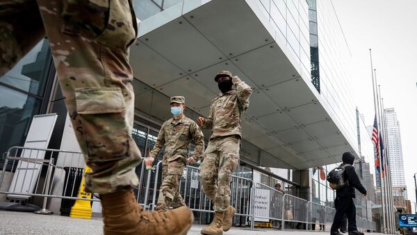 US military personnel wearing face masks walk outside the Jacob K. Javits Convention Center, which was converted into a hospital during the outbreak of the coronavirus disease (COVID-19), in New York City, US April 27, 2020 - Sputnik International