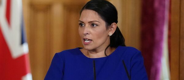 Britain's Home Secretary Priti Patel holds daily digital news conference with NHS Medical Director, Professor Stephen Powis (not pictured) and NCA Director General, Lynne Owens (not pictured) on the coronavirus disease (COVID-19) outbreak, at 10 Downing Street in London, Britain April 25, 2020.  - Sputnik International