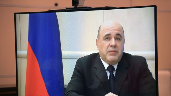 Russian Prime Minister Mikhail Mishustin (on monitor) during a video conference with Russian President Vladimir Putin. - Sputnik International