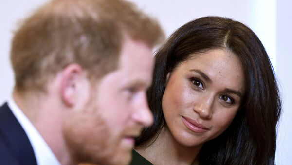 The Duchess of Sussex gazes at her husband Prince Harry - Sputnik International