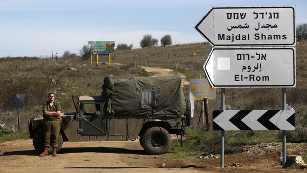 Israeli soldiers block a road leading to the Syrian border in the Israeli-annexed Golan Heights on March 5, 2020. - Syrian air defence responded to Israeli missiles targeting the south and centre of the country, state media said early today. Our air defence confronted an Israeli missile attack in the southwest of Quneitra province in the south and also in a central region, SANA news agency said. The short statement released after midnight did not provide details on the targets. Quneitra province is near the Israeli-annexed Golan Heights.  - Sputnik International