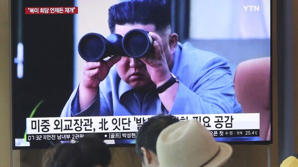 People watch a TV showing a file footage of North Korean leader Kim Jong Un during a news program at the Seoul Railway Station in Seoul, South Korea, Friday, Aug. 2, 2019 - Sputnik International