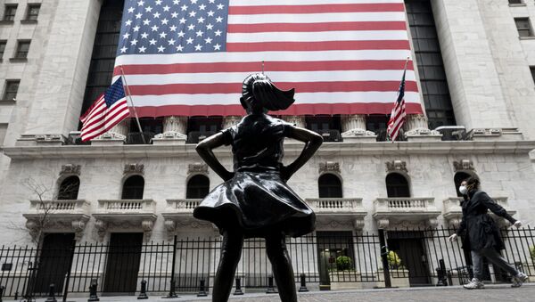 In this file photo The Fearless Girl statue and the New York Stock Exchange (NYSE) are pictured on April 20, 2020 at Wall Street in New York City. - Wall Street stocks jumped early April 28, 2020, extending April's upward trend after mixed earnings from a wide range of large companies. About five minutes into trading, the Dow Jones Industrial Average stood at 24,452.99, up 1.3 percent.The broad-based S&P 500 gained 1.2 percent to 2,913.24, while the tech-rich Nasdaq Composite Index advanced 0.9 percent to 8,807.81. - Sputnik International