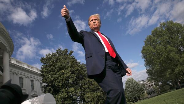 US President Donald Trump give a thumbs up to reporters and cameras as he heads to the Marine One helicopter to depart for a weekend at Camp David from the South Lawn of the White House in Washington, US, 1 May 2020. - Sputnik International