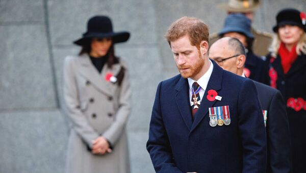 Britain's Prince Harry and his fiancee Meghan Markle, background attend an Anzac Day dawn service, at Hyde Park Corner in London, Wednesday, April 25, 2018 - Sputnik International