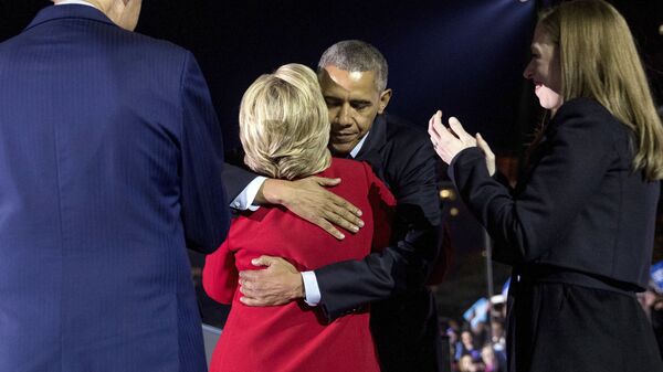 Democratic presidential candidate Hillary Clinton, accompanied by her daughter Chelsea Clinton, right, and former President Bill Clinton, left, hugs President Barack Obama after speaking at a rally at Independence Mall in Philadelphia, Monday, Nov. 7, 2016 - Sputnik International