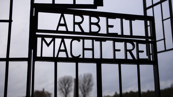 The gate of the Sachsenhausen Nazi death camp with the phrase 'Arbeit macht frei' (work sets you free) stands open at the International Holocaust Remembrance Day, in Oranienburg, about 30 kilometers, (18 miles) north of Berlin, Germany, Sunday, Jan. 27, 2019. The International Holocaust Remembrance Day marks the liberation of the Auschwitz Nazi death camp on Jan. 27, 1945. - Sputnik International