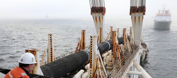 Picture taken on November 15, 2018 shows a man standing on the pipe-laying ship Audacia looking on as tubes are laid for the Nord Stream 2 gas pipeline off the coast of the Baltic Sea island Ruegen, northeastern Germany. Picture taken on November 15, 2018 shows a man standing on the pipe-laying ship Audacia looking on as tubes are laid for the Nord Stream 2 gas pipeline off the coast of the Baltic Sea island Ruegen, northeastern Germany. - Sputnik International