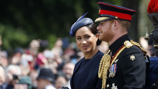 In this 8 June, 2019 file photo, Meghan Markle and Prince Harry ride in a carriage to attend the annual Trooping the Colour Ceremony in London - Sputnik International