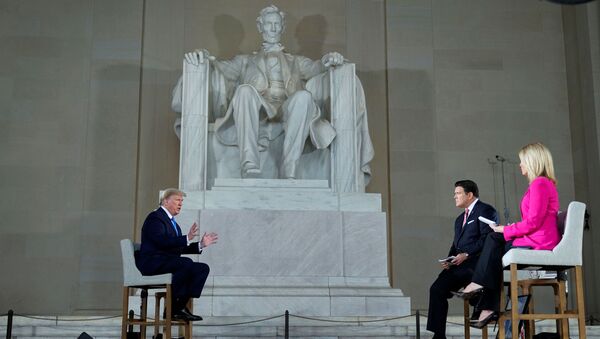 U.S. President Donald Trump is interviewed by hosts hosts Bret Baier and Martha MacCallum during a Fox News Channel virtual town hall called America Together: Returning to Work about the response to the coronavirus disease (COVID-19) pandemic while sitting in front of the statue of former President Abraham Lincoln inside the Lincoln Memorial in Washington, U.S. May 3, 2020 - Sputnik International