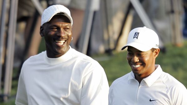 Tiger Woods, right, and Michael Jordan, left, share a laugh as they walk down the first fairway during the pro-am for the Wachovia Championship golf tournament at Quail Hollow Club in Charlotte, NC, 2 May 2007. - Sputnik International