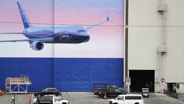 Activity begins to return at the massive Boeing airplane production plant Tuesday, April 21, 2020, in Everett, Wash. Boeing this week is restarting production of commercial airplanes in the Seattle area, putting about 27,000 people back to work after operations were halted because of the coronavirus. - Sputnik International