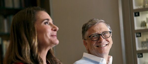 In this Feb. 1, 2019 photo, Bill Gates looks to his wife Melinda as they are interviewed in Kirkland, Wash. The couple, whose foundation has the largest endowment in the world, are pushing back against a new wave of criticism about whether billionaire philanthropy is a force for good. They said they’re not fazed by recent blowback against wealthy giving, including viral moments at the World Economic Forum and the shifting political conversation about taxes and socialism.  - Sputnik International