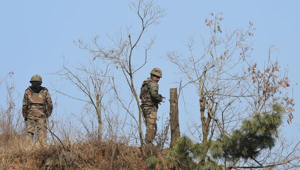 Indian army personnel patrol near the site of a gunbattle between Indian troops and suspected militants at Pakharpora in the district of Budgam  - Sputnik International
