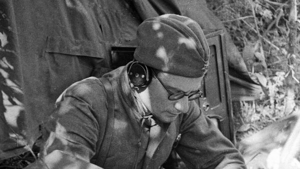A Soviet radio operator jots down information from the Sovinformbureau, May 1942. - Sputnik International