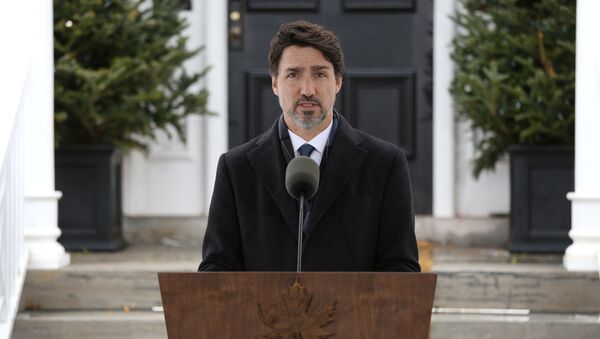 In this file photo taken on March 17, 2020 Canadian Prime Minister Justin Trudeau speaks during a news conference on COVID-19 situation in Canada from his residence in Ottawa, Canada. - Sputnik International