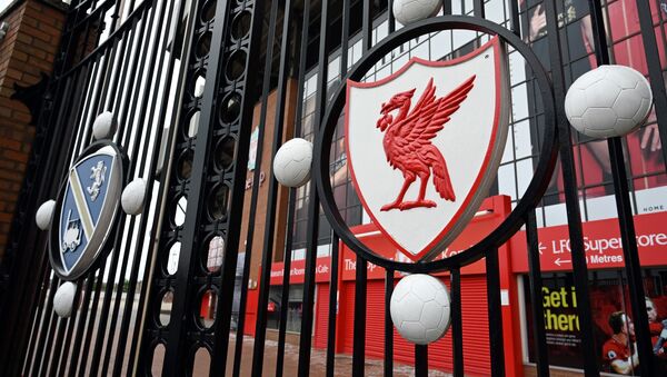 In this file photo taken on 18 April 2020 a locked gate and emblem are seen at Liverpool football club's stadium Anfield in Liverpool, northwest England. - Sputnik International