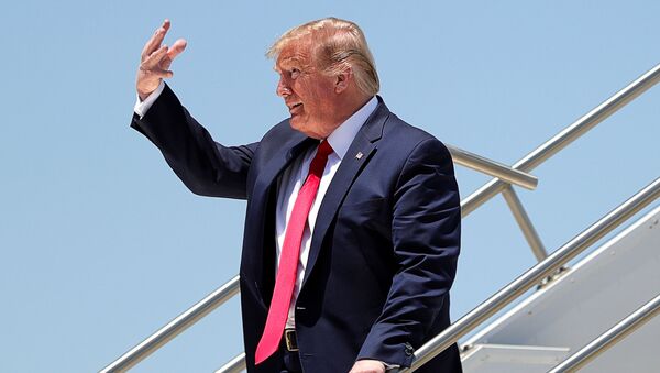 U.S. President Donald Trump gestures as he arrives at Sky International Airport prior to touring a Honeywell mask production facility manufacturing protective masks for the coronavirus disease (COVID-19) pandemic in Phoenix, Arizona, U.S., May 5, 2020. - Sputnik International