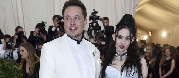 Elon Musk, left and Grimes attends The Metropolitan Museum of Art's Costume Institute benefit gala celebrating the opening of the Heavenly Bodies: Fashion and the Catholic Imagination exhibition on Monday, May 7, 2018, in New York. Elon Musk, left and Grimes attends The Metropolitan Museum of Art's Costume Institute benefit gala celebrating the opening of the Heavenly Bodies: Fashion and the Catholic Imagination exhibition on Monday, May 7, 2018, in New York. - Sputnik International