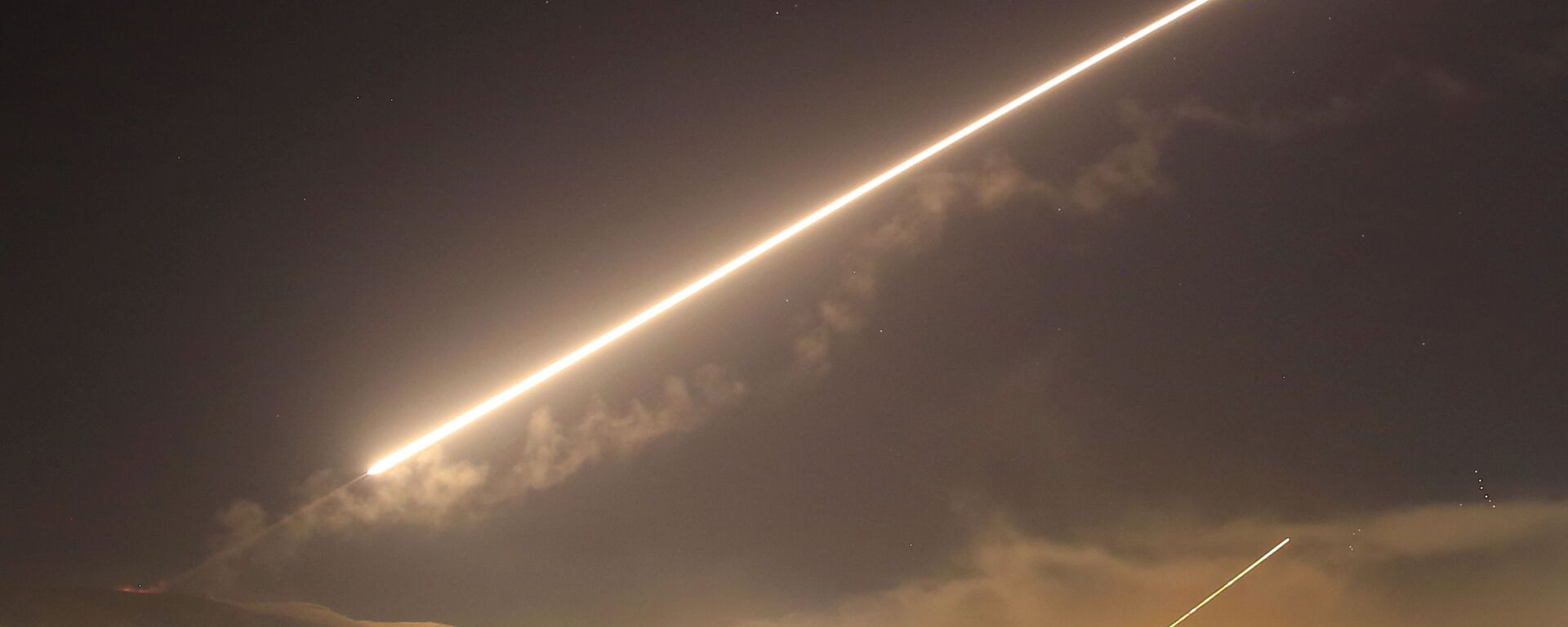 FILE - In this April 14, 2018 file photo, Damascus skies erupt with surface to air missile fire as the U.S. launches an attack on Syria targeting different parts of the Syrian capital Damascus, Syria - Sputnik International, 1920, 01.04.2024