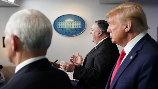 U.S. Vice President Mike Pence and President Donald Trump listen as Secretary of State Mike Pompeo addresses the daily coronavirus task force briefing at the White House in Washington, U.S., April 8, 2020 - Sputnik International