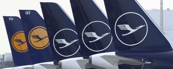 German Lufthansa planes sit parked in a line at the airport in Munich, Germany, Thursday, March 26, 2020 German Lufthansa planes sit parked in a line at the airport in Munich, Germany, Thursday, March 26, 2020 - Sputnik International