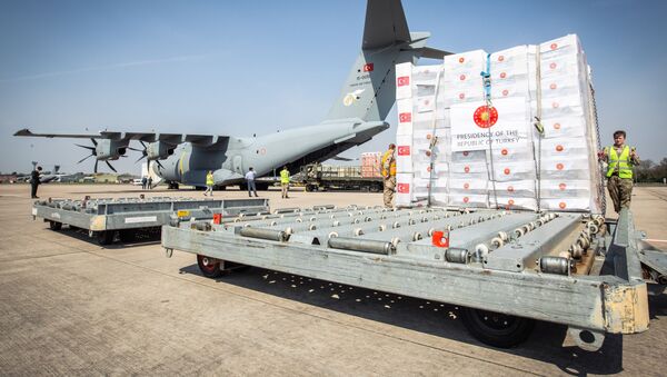 Crucial supplies of personal protective equipment (PPE) for medical staff are delivered from Turkey into a Royal Air Force base for distribution around the country, amid the coronavirus disease (COVID-19) outbreak, in Carterton, Britain, April 10, 2020 - Sputnik International