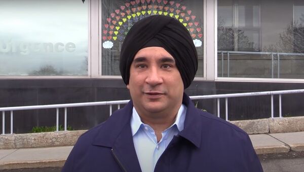 Dr. Sanjeet Singh-Saluja, a Sikh doctor who shaved his beard in order to treat COVID-19 patients at the Montreal General Hospital, on Monday May 4, 2020 - Sputnik International