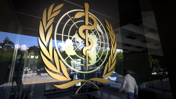 A sign of the World Health Organization (WHO) is seen at the entrance of the UN specialised agency's headquarters on May 18, 2018 in Geneva - Sputnik International