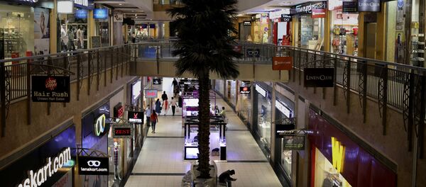 Few shoppers are seen inside a shopping mall amid a new virus outbreak in New Delhi, India, Tuesday, March 17, 2020 - Sputnik International