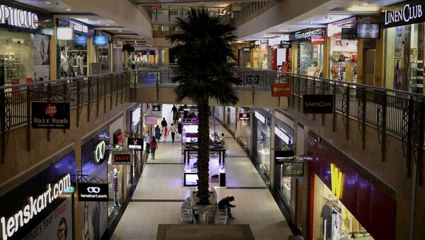 Few shoppers are seen inside a shopping mall amid a new virus outbreak in New Delhi, India, Tuesday, March 17, 2020 - Sputnik International